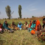 Women sitting in a field