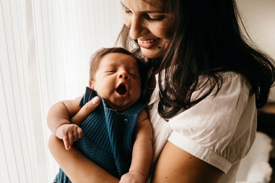 Women are often lauded for being “warm” and “nurturing”, qualities which tend to be associated with motherhood and caregiving. Photo by Jonathan Borba via Unsplash